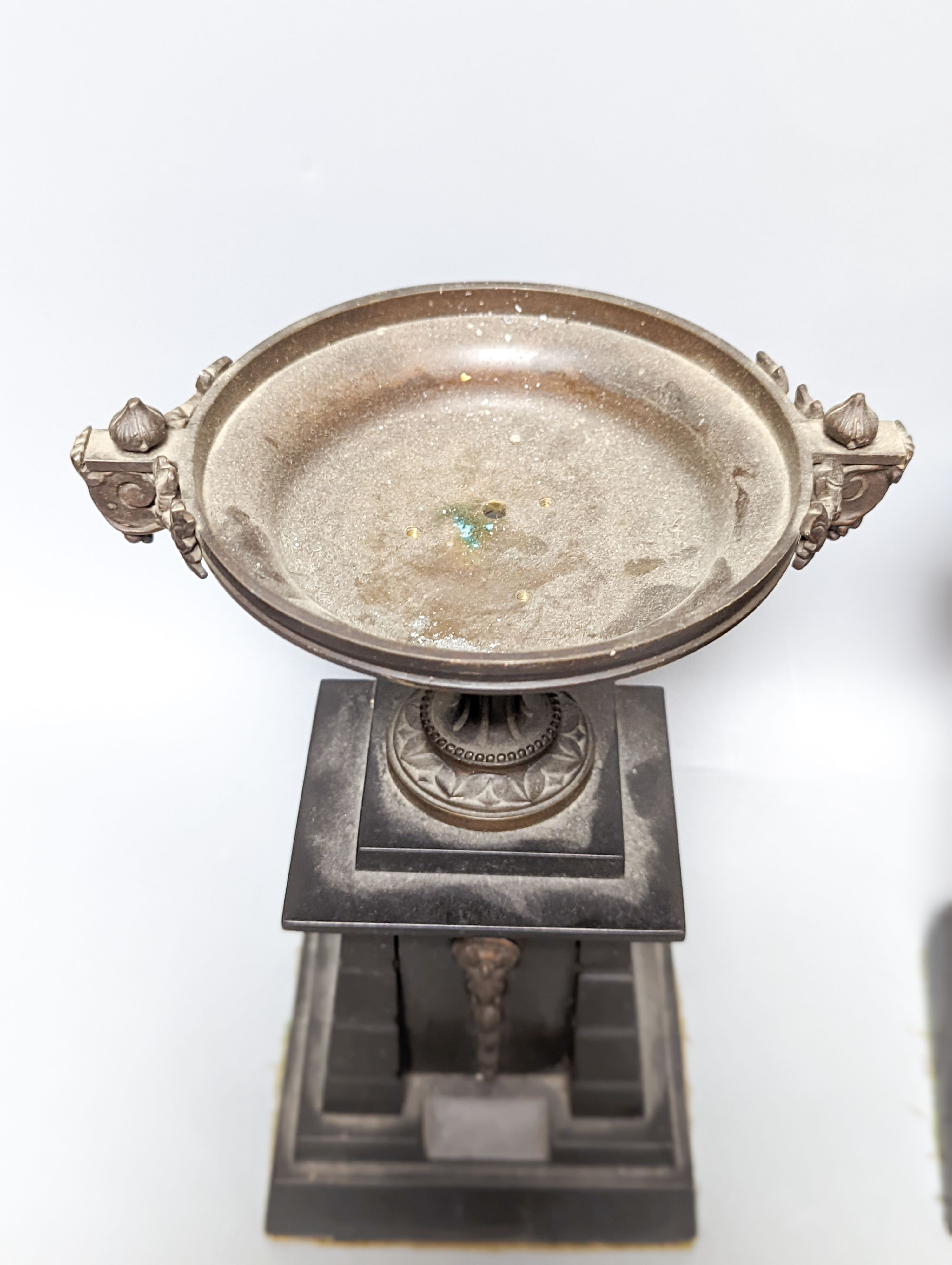 A pair of bronze tazzas on architectural slate bases, c.1900, together with a third, associated piece (3) 25cm
